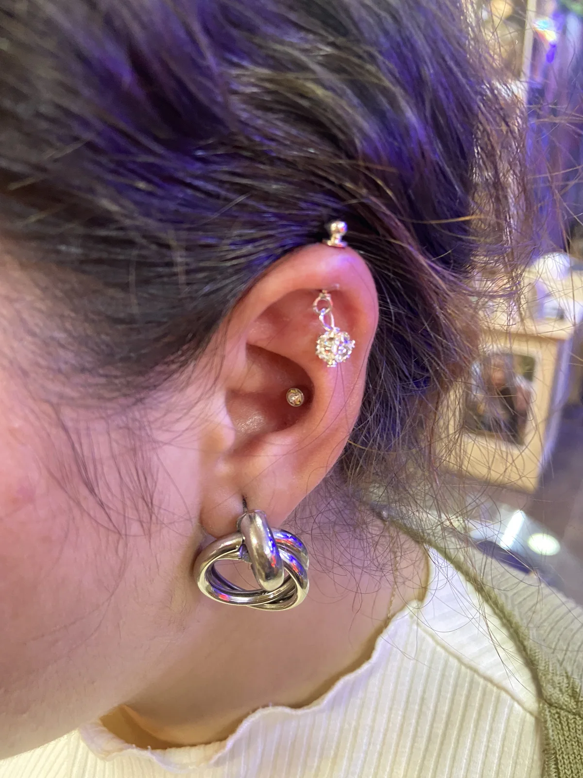 Multiple ear piercings with fine jewellery at Sid Ink Tattoo, Sarojini Nagar Delhi